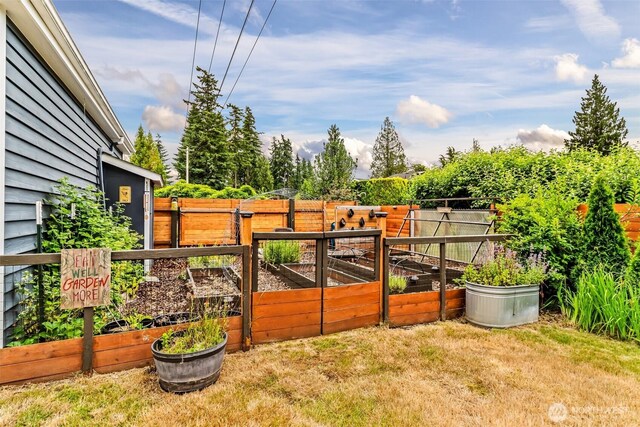 233 Joann Ln, Arlington, WA 98223 - fenced yard featuring a vegetable garden