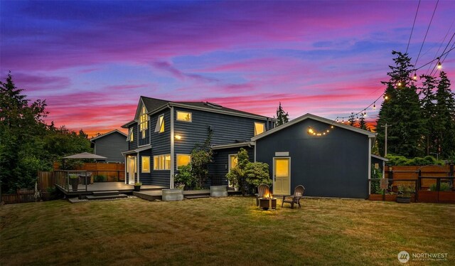 233 Joann Ln, Arlington, WA 98223 - rear view of property featuring a wooden deck and an outdoor fire pit