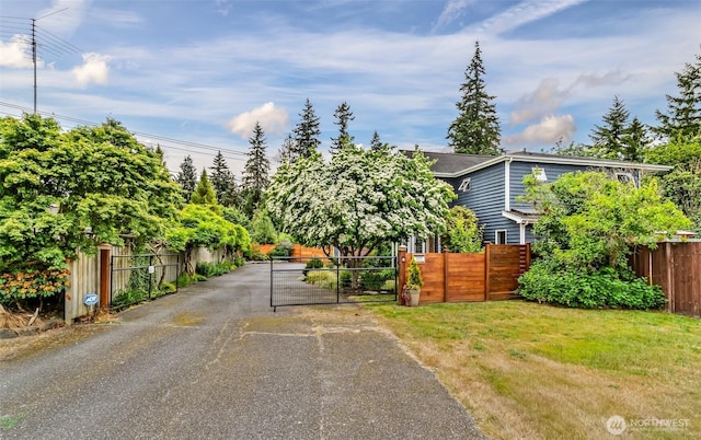 233 Joann Ln, Arlington, WA 98223 - view of front of house featuring asphalt driveway and a gate