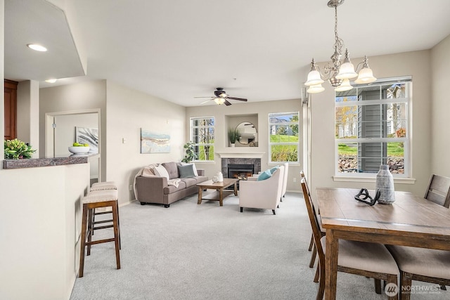 1855 Trossachs Blvd SE Unit 1401, Sammamish, WA 98075 - carpeted living area with a chandelier, a premium fireplace, and a ceiling fan
