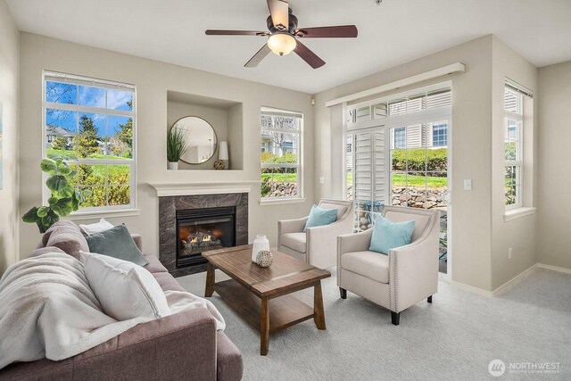 1855 Trossachs Blvd SE Unit 1401, Sammamish, WA 98075 - living room featuring a fireplace, light carpet, and a ceiling fan