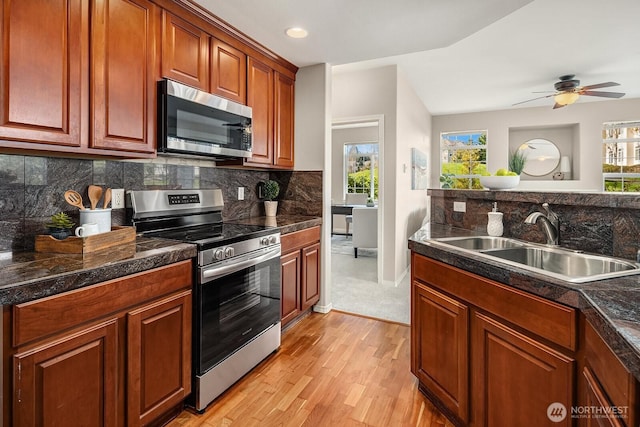 1855 Trossachs Blvd SE Unit 1401, Sammamish, WA 98075 - kitchen with appliances with stainless steel finishes, tile countertops, light wood-style floors, backsplash, and recessed lighting