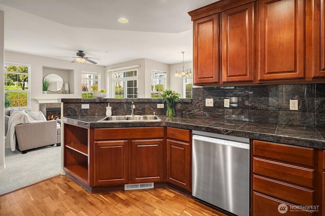 1855 Trossachs Blvd SE Unit 1401, Sammamish, WA 98075 - kitchen with stainless steel dishwasher, tile countertops, a peninsula, open floor plan, and light wood-style flooring