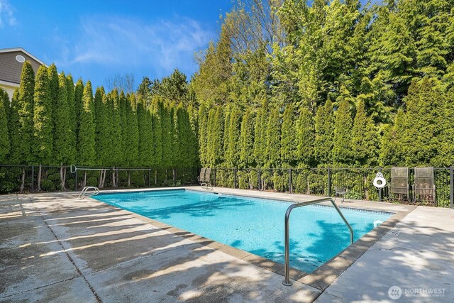 1855 Trossachs Blvd SE Unit 1401, Sammamish, WA 98075 - view of swimming pool with a forest view and a patio area