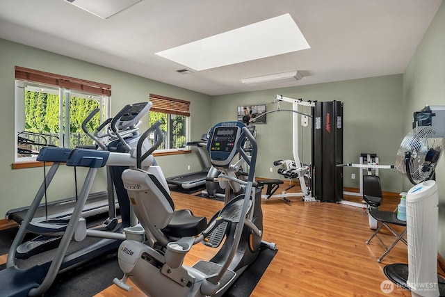 1855 Trossachs Blvd SE Unit 1401, Sammamish, WA 98075 - exercise room with a skylight and wood finished floors
