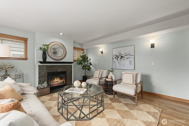 9400 35th Ave SW, Seattle, WA 98126 - living area with wood finished floors, a tiled fireplace, and recessed lighting