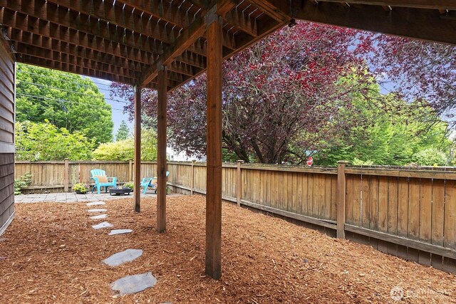 9400 35th Ave SW, Seattle, WA 98126 - fenced backyard with an outdoor fire pit