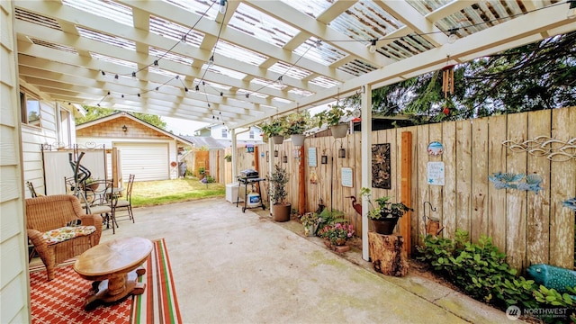 1215 273rd Pl, Ocean Park, WA 98640 - fenced backyard with an outbuilding, a patio area, and a pergola