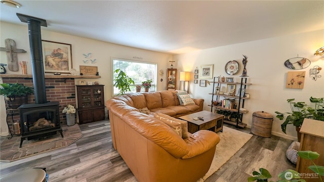 1215 273rd Pl, Ocean Park, WA 98640 - living area featuring a wood stove and wood finished floors