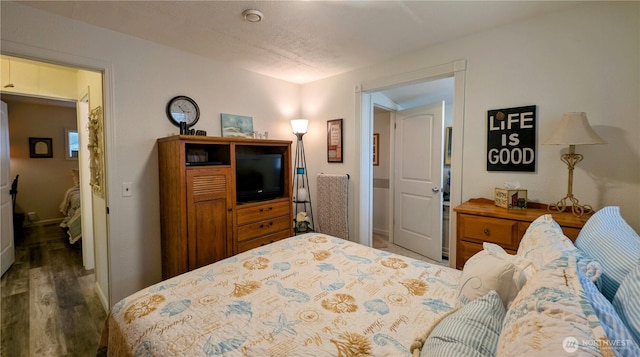 1215 273rd Pl, Ocean Park, WA 98640 - bedroom with wood finished floors and baseboards