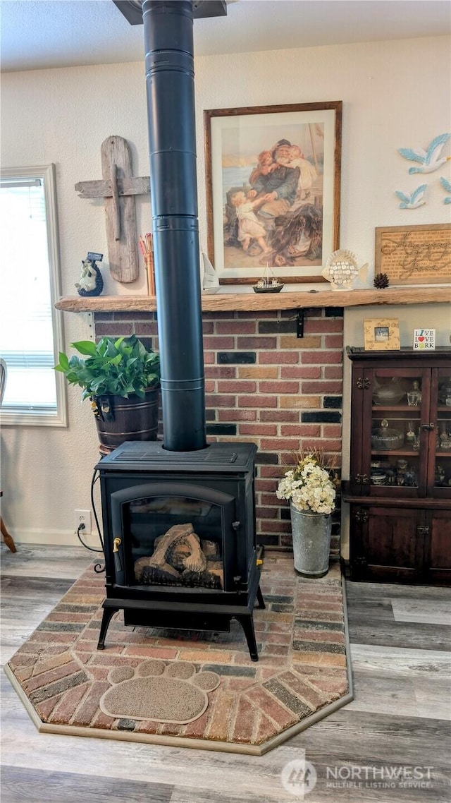 1215 273rd Pl, Ocean Park, WA 98640 - detailed view of a wood stove and wood finished floors