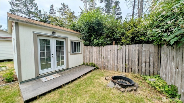 1215 273rd Pl, Ocean Park, WA 98640 - view of yard featuring french doors, a fire pit, and an outdoor structure