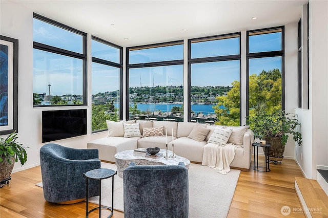 2501 Yale Ave E, Seattle, WA 98102 - living area with floor to ceiling windows, a water view, and wood finished floors