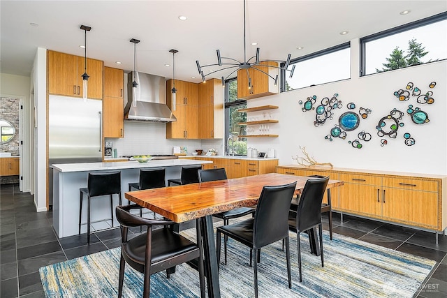 2501 Yale Ave E, Seattle, WA 98102 - kitchen featuring wall chimney range hood, light countertops, open shelves, healthy amount of natural light, and recessed lighting