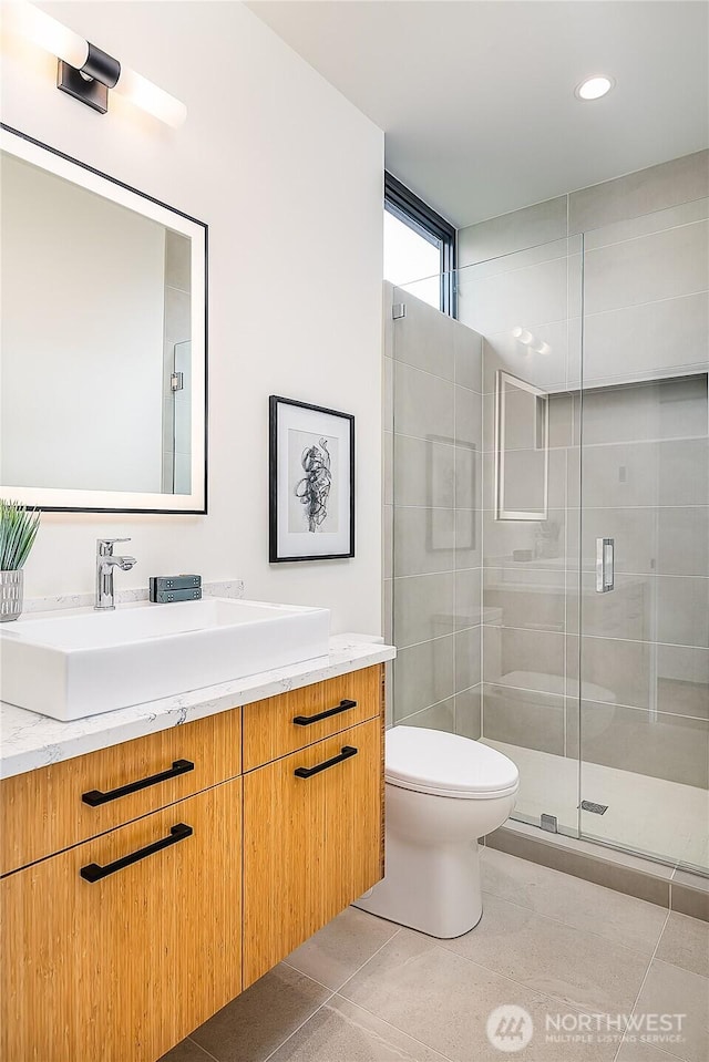 2501 Yale Ave E, Seattle, WA 98102 - bathroom with vanity, a shower stall, tile patterned floors, and recessed lighting