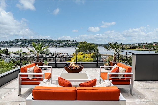 2501 Yale Ave E, Seattle, WA 98102 - balcony with an outdoor living space with a fire pit and a water view