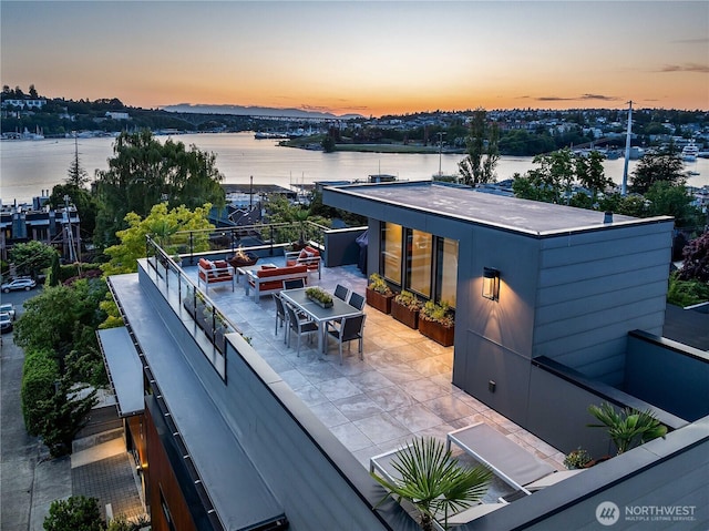 2501 Yale Ave E, Seattle, WA 98102 - back of property with a water view, outdoor dining area, and a patio area