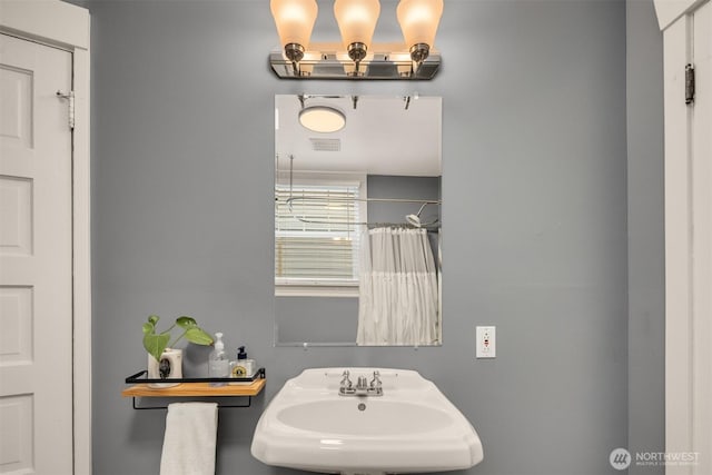 325 23rd Ave E, Seattle, WA 98112 - full bath with a sink and curtained shower
