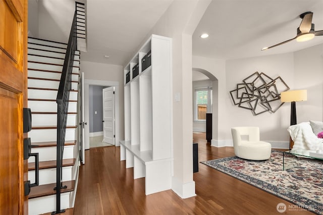325 23rd Ave E, Seattle, WA 98112 - hallway featuring arched walkways, dark wood-type flooring, recessed lighting, and stairs