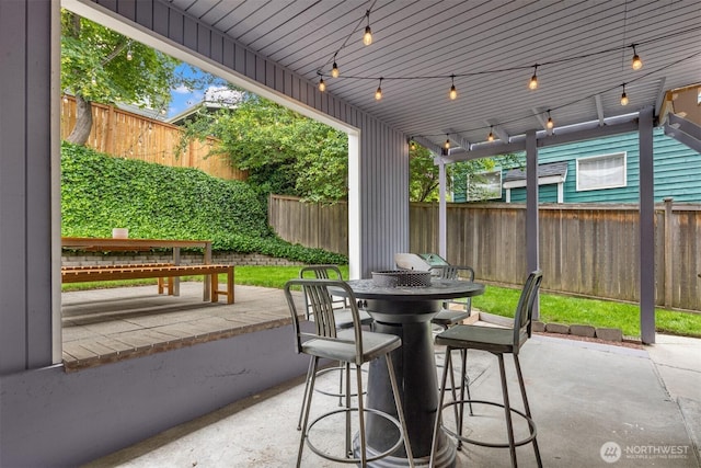 325 23rd Ave E, Seattle, WA 98112 - fenced backyard with outdoor dining space and a patio