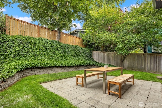 325 23rd Ave E, Seattle, WA 98112 - fenced backyard featuring a patio area