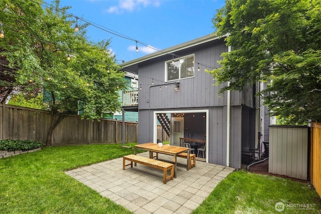 325 23rd Ave E, Seattle, WA 98112 - rear view of house featuring a patio and a fenced backyard