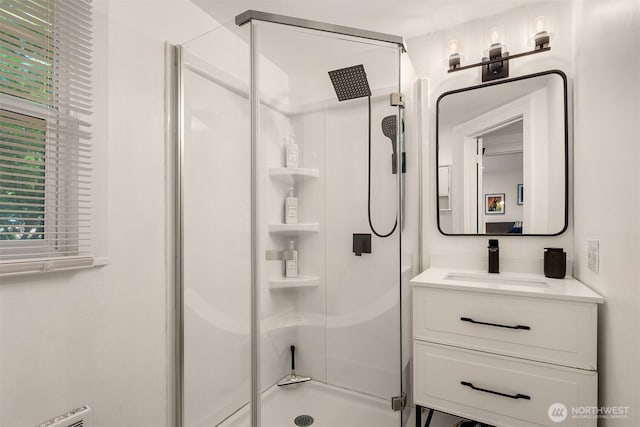 325 23rd Ave E, Seattle, WA 98112 - full bathroom with a stall shower, vanity, and healthy amount of natural light
