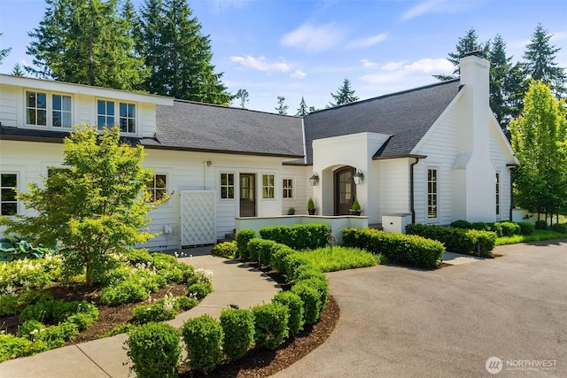 303 39th Ave NE, Olympia, WA 98506 - view of front facade with a shingled roof and a chimney