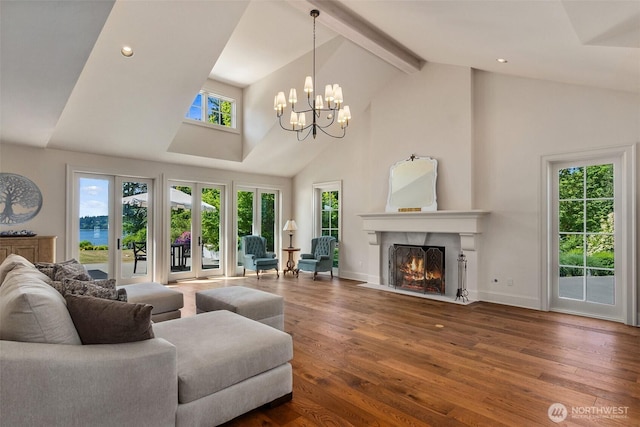 303 39th Ave NE, Olympia, WA 98506 - living area with high vaulted ceiling, a chandelier, wood finished floors, a fireplace with flush hearth, and beam ceiling
