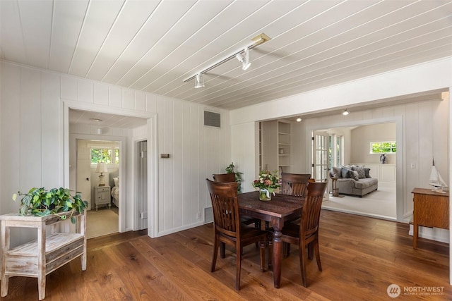 303 39th Ave NE, Olympia, WA 98506 - dining area featuring rail lighting, wood finished floors, and wooden ceiling