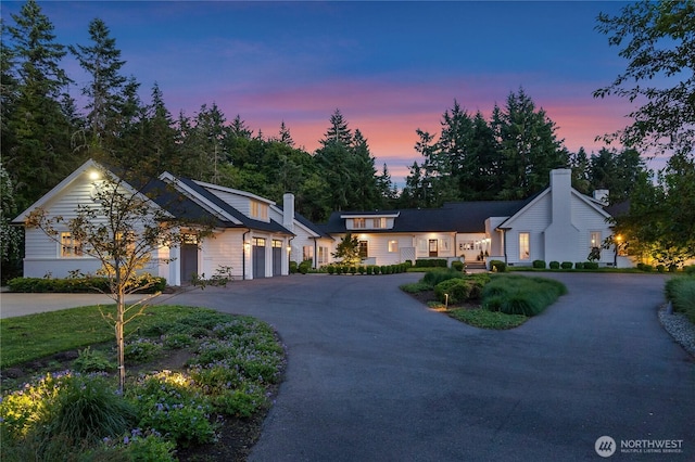 303 39th Ave NE, Olympia, WA 98506 - view of front of property with a chimney, driveway, and an attached garage