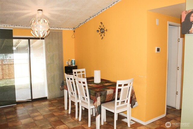 5705 Littlerock Rd SW Unit 41, Tumwater, WA 98512 - dining area with a chandelier and stone finish flooring