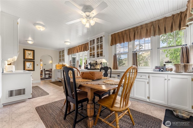 3A Ross Rd, Twisp, WA 98856 - dining space with arched walkways, ceiling fan, and crown molding