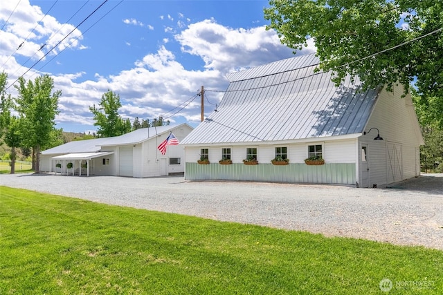 3A Ross Rd, Twisp, WA 98856 - view of front facade featuring gravel driveway, a front lawn, and a metal roof