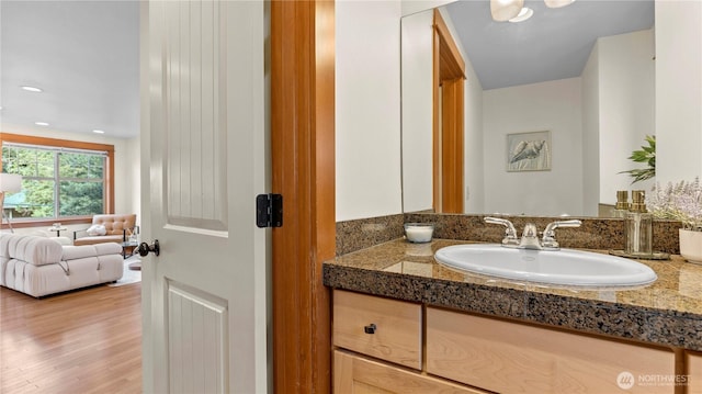 743 94th St N Unit B, Seattle, WA 98103 - bathroom with vanity, wood finished floors, and recessed lighting