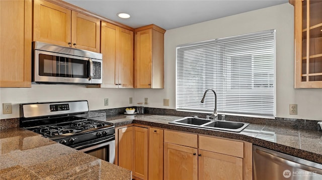 743 94th St N Unit B, Seattle, WA 98103 - kitchen featuring appliances with stainless steel finishes, tile countertops, glass insert cabinets, light brown cabinetry, and recessed lighting