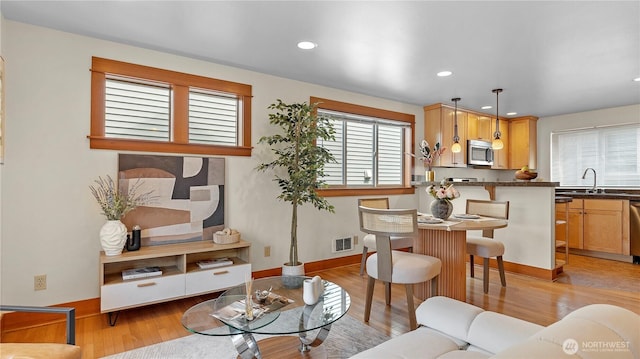 743 94th St N Unit B, Seattle, WA 98103 - living room with light wood-style floors and recessed lighting