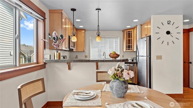743 94th St N Unit B, Seattle, WA 98103 - dining space featuring plenty of natural light, wood finished floors, and recessed lighting