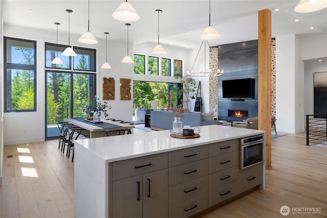 3847 Swiftwater Dr, Cle Elum, WA 98922 - kitchen featuring light wood-style flooring, gray cabinetry, light countertops, and recessed lighting