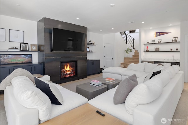 3847 Swiftwater Dr, Cle Elum, WA 98922 - living room with stairs, a large fireplace, bar area, and recessed lighting