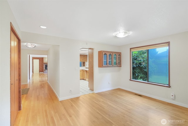 2004 SW 306th Pl, Federal Way, WA 98023 - spare room with light wood-style flooring and baseboards