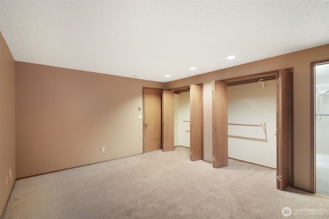 2004 SW 306th Pl, Federal Way, WA 98023 - unfurnished bedroom featuring multiple closets, light carpet, and recessed lighting