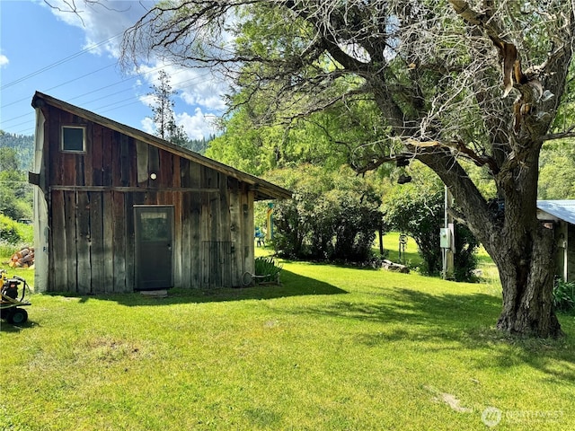 390 Customs Rd, Curlew, WA 99118 - view of grassy yard featuring an outbuilding