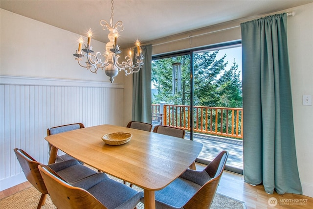 339 Highlands Dr, Orcas Island, WA 98245 - dining room featuring a chandelier and wood finished floors