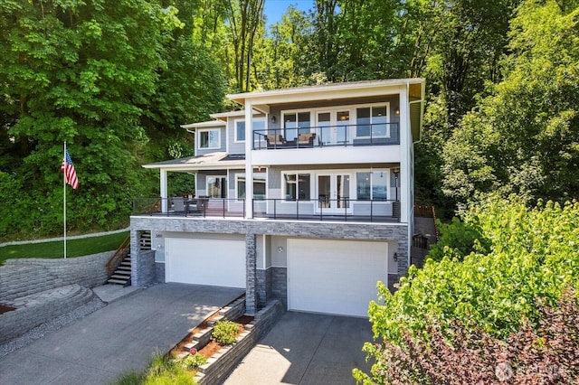 3811 N Dale St, Tacoma, WA 98407 - view of front of property featuring a balcony, french doors, driveway, stairway, and a garage