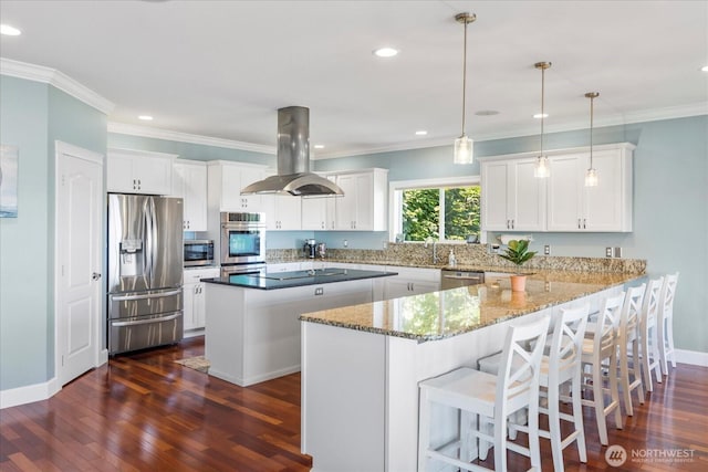 3811 N Dale St, Tacoma, WA 98407 - kitchen featuring appliances with stainless steel finishes, island range hood, dark wood-type flooring, recessed lighting, and white cabinetry