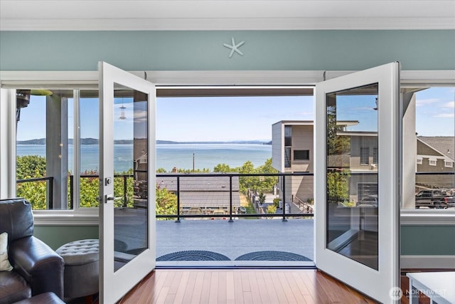 3811 N Dale St, Tacoma, WA 98407 - doorway featuring french doors, a water view, ornamental molding, and hardwood / wood-style flooring