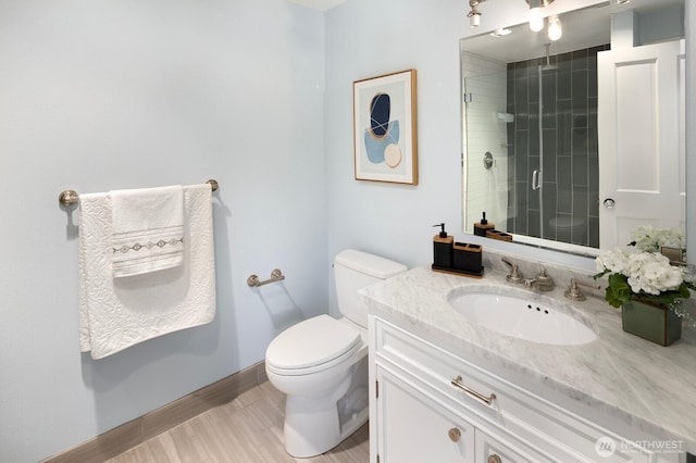 8234 NE 8th St, Medina, WA 98039 - full bathroom with vanity, a shower stall, and wood finished floors