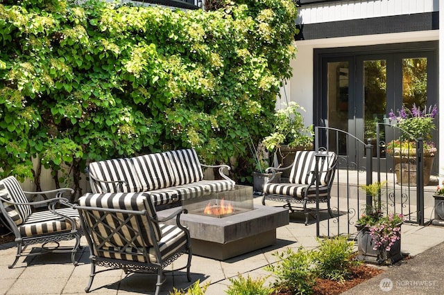 8234 NE 8th St, Medina, WA 98039 - view of patio with french doors and an outdoor living space with a fire pit