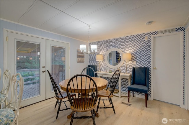 1411 297th Ln, Ocean Park, WA 98640 - dining room with light wood-style floors, ornamental molding, and a chandelier